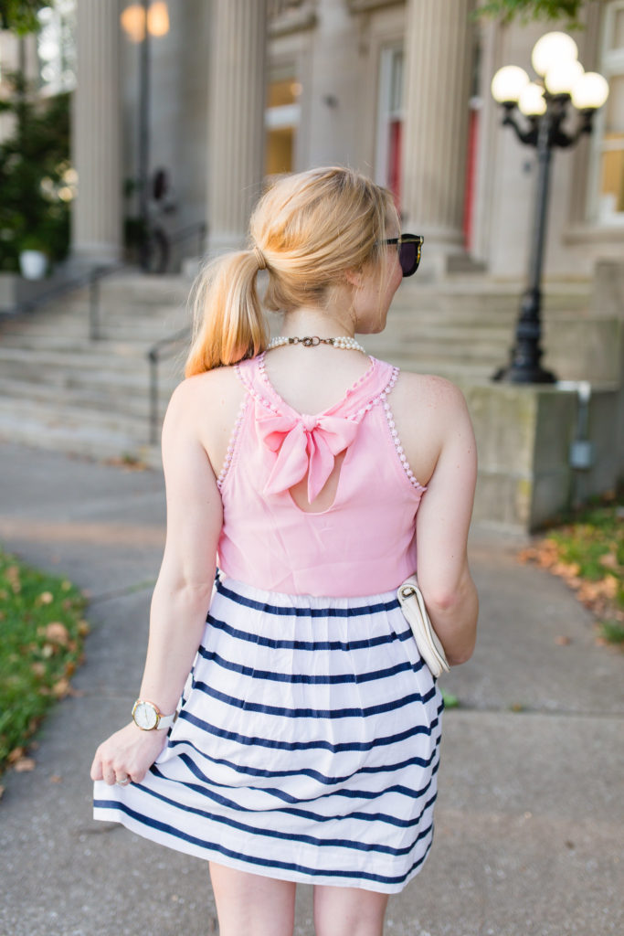 pink bow blouse striped skirt